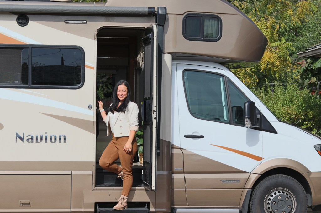 eva standing at RV's door
