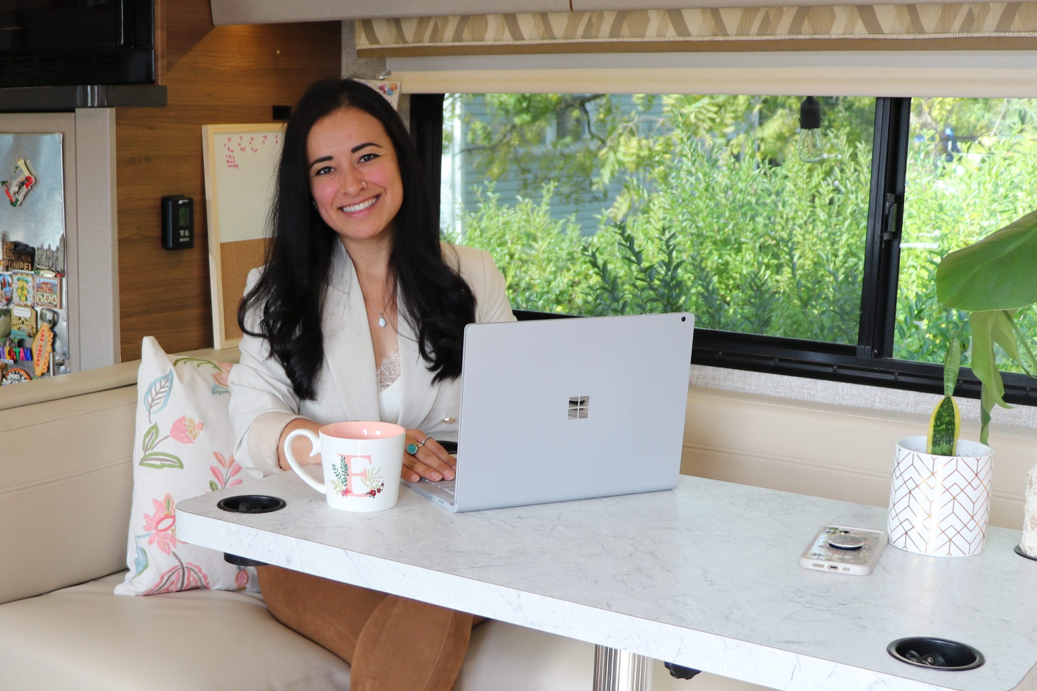 Eva inside RV with computer